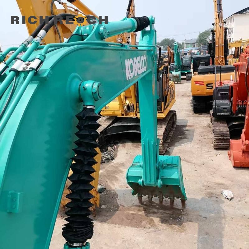 Rear view and exhaust system of a 2017 Kobelco SK130LC excavator, 500 hours, $20,833